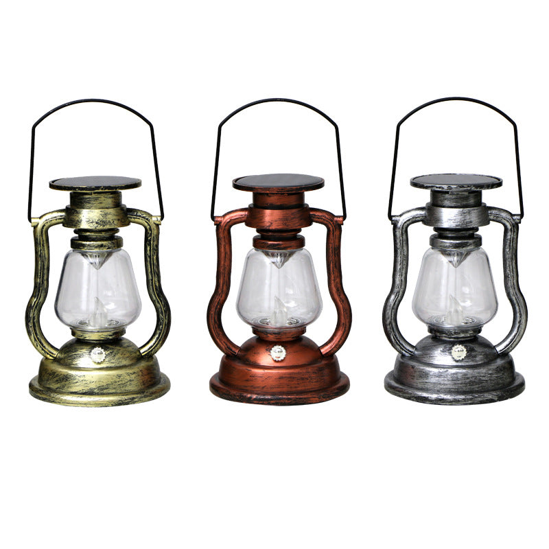 Solar powered lantern in silver colour hanging outdoors