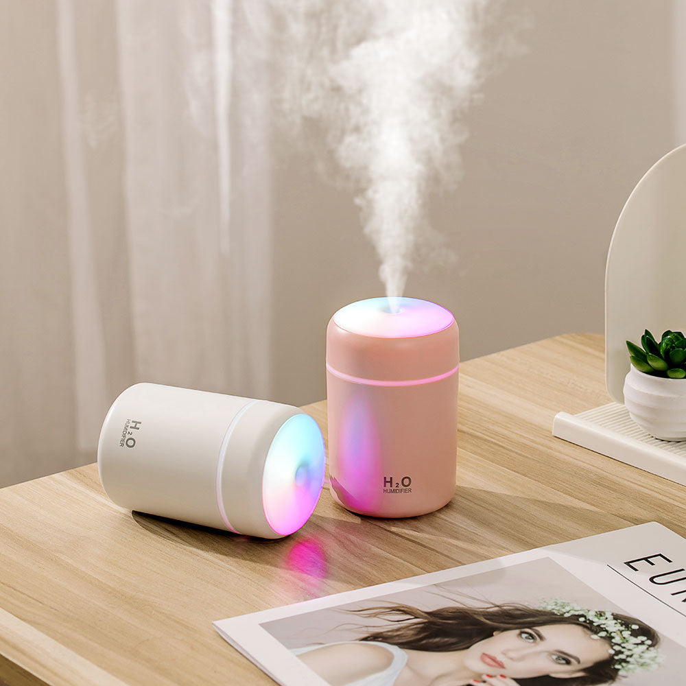 Lumora Mini USB Humidifier misting on desk in white
