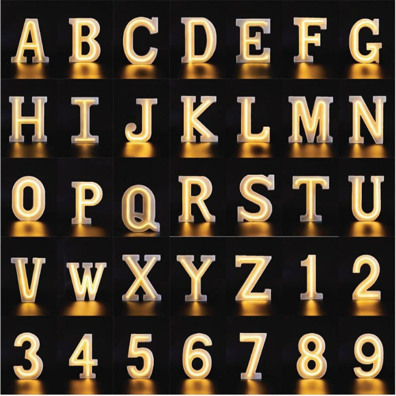 Neon letter sign 20cm size on desk against dark background