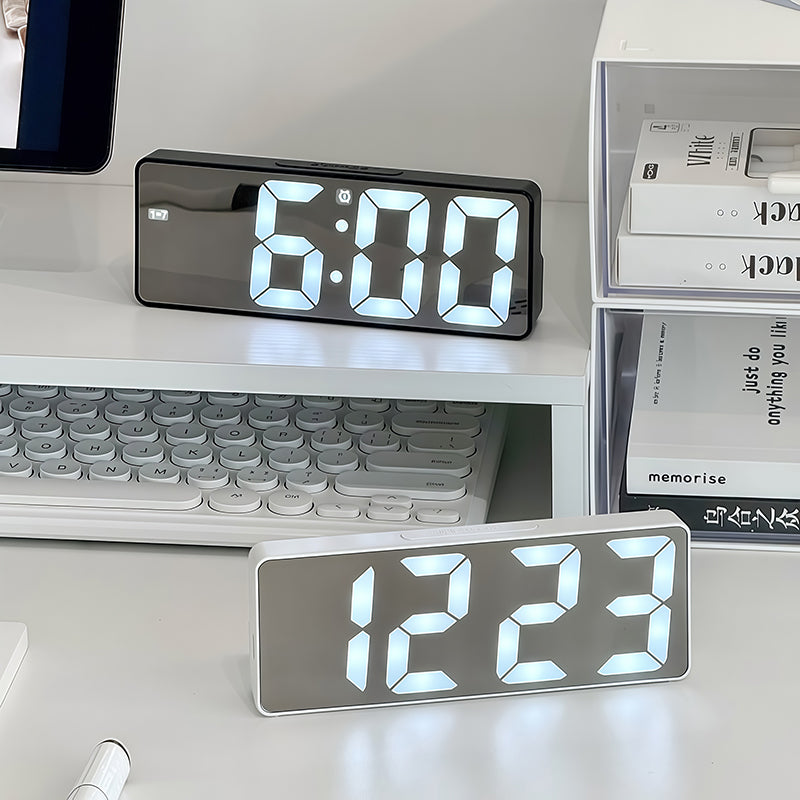 Lumora LED Digital Alarm Clock on desk showing time and temperature