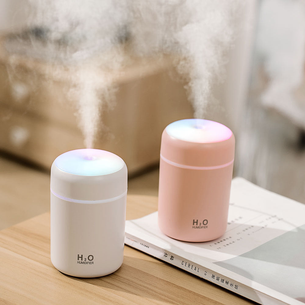 Lumora USB humidifier in grey showing mist output