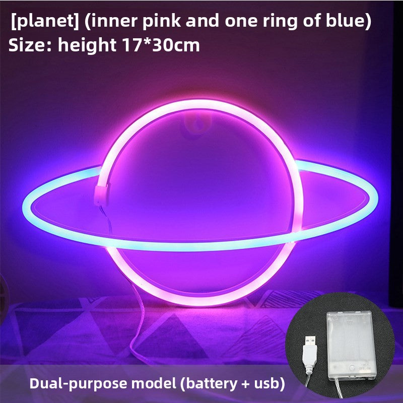 Planet neon sign hanging on wall in kids space-themed bedroom