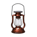 Vintage solar lantern in rust colour as garden decor