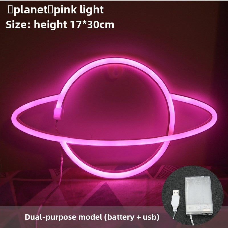 Neon planet light as space decor on desk shelf