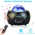 Lumora™ Ocean Wave Star Projector projecting blue wave and star effects on bedroom ceiling